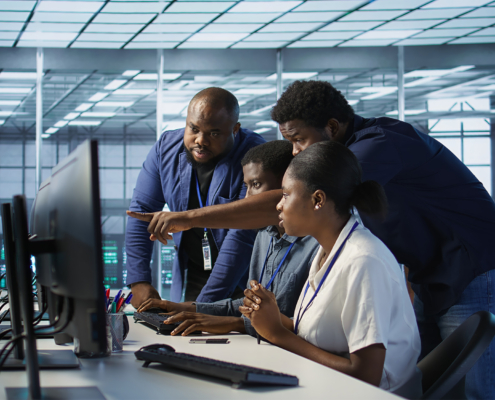 Teamworking engineers talking in server room, developing disaster recovery